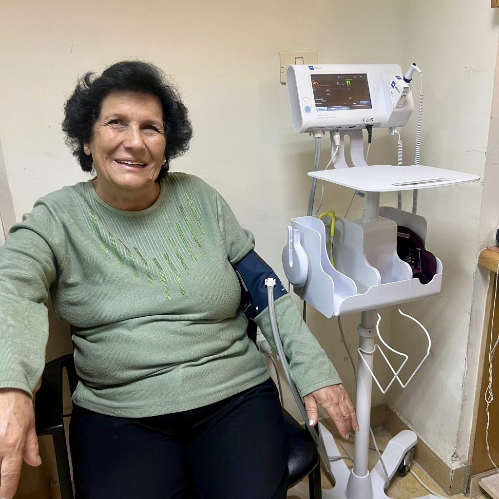 woman getting blood pressure taken at womens clinic
